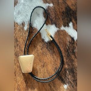 Elegant Gold and Black Leather Bolo Tie